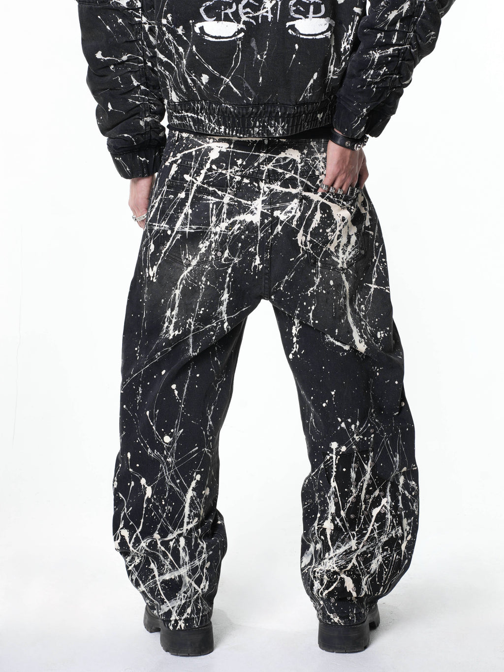 “Relationship“ Printed Splashed Ink Washed Jeans in Black Denim