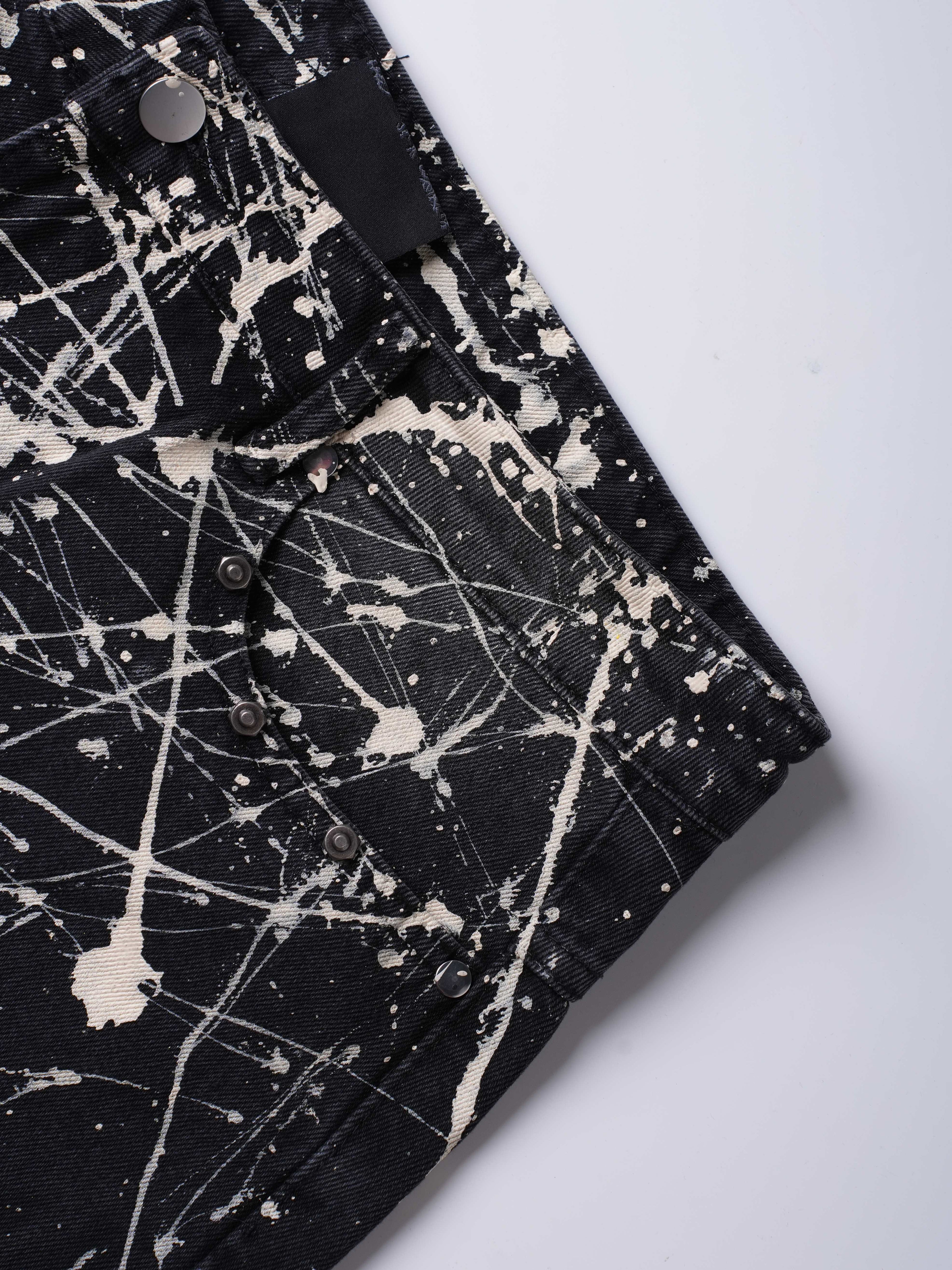 “Relationship“ Printed Splashed Ink Washed Jeans in Black Denim